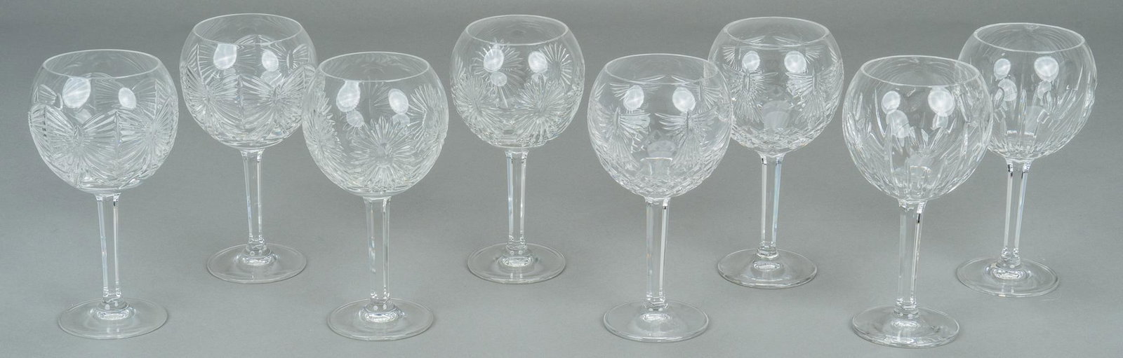 Waterford Crystal Water Goblets: Eight (8) red wine glasses from The Millennium Collection by Waterford Crystal of various motifs including Love, Happiness, Prosperity and Health. Height 7 7/8 in. Provenance: A Burton, Texas collecti