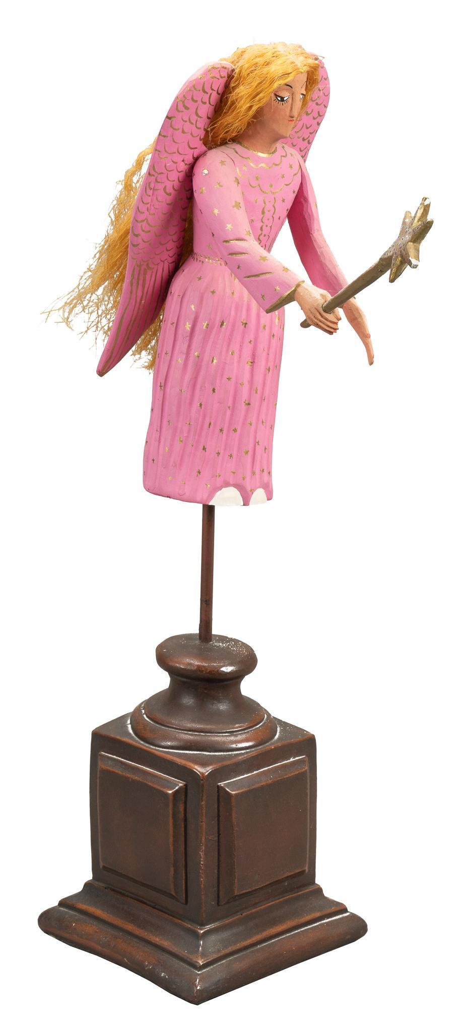 Epifanio Fuentes (MEX), Carved Angel: Epifanio Fuentes (Oaxaca, Mexico), hand-carved angel, with painted decoration, straw hair, supported on detachable base signed height 24 in. x width 6.5 in. x depth 12 in. Provenance: A San Antonio