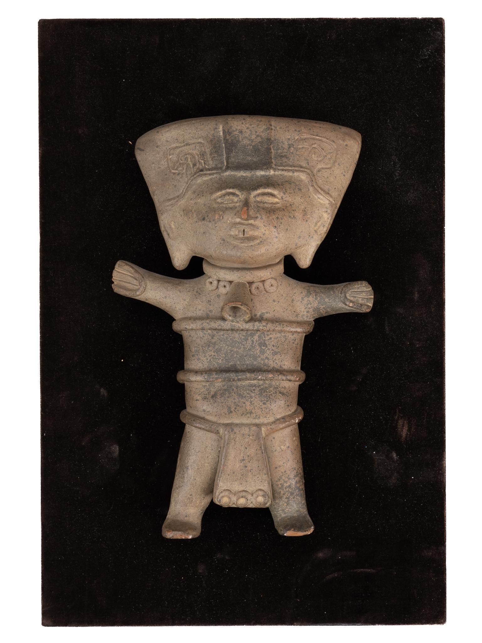 Vera Cruz Style Smiling Whistle: Pre-Columbian style terracotta whistle, after Vera Cruz smiling figures (sonrientes), framed height 15 in. x width 10 in. x depth 3 in. Provenance: Property from a former Army Retirement Community res