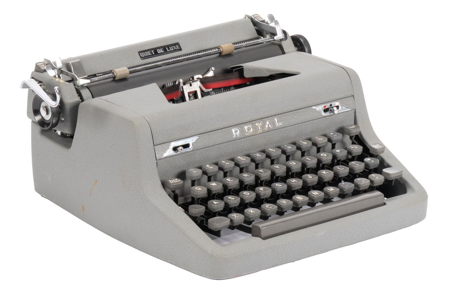 Royal Quiet De Luxe Typewriter: Royal Quiet De Luxe typewriter, gray exterior, from Royal Typewriter Co. Inc. (New York, USA), with yellow case, circa 1950s, used by Larry McMurtry in his Archer City, Texas home writing studio; incl