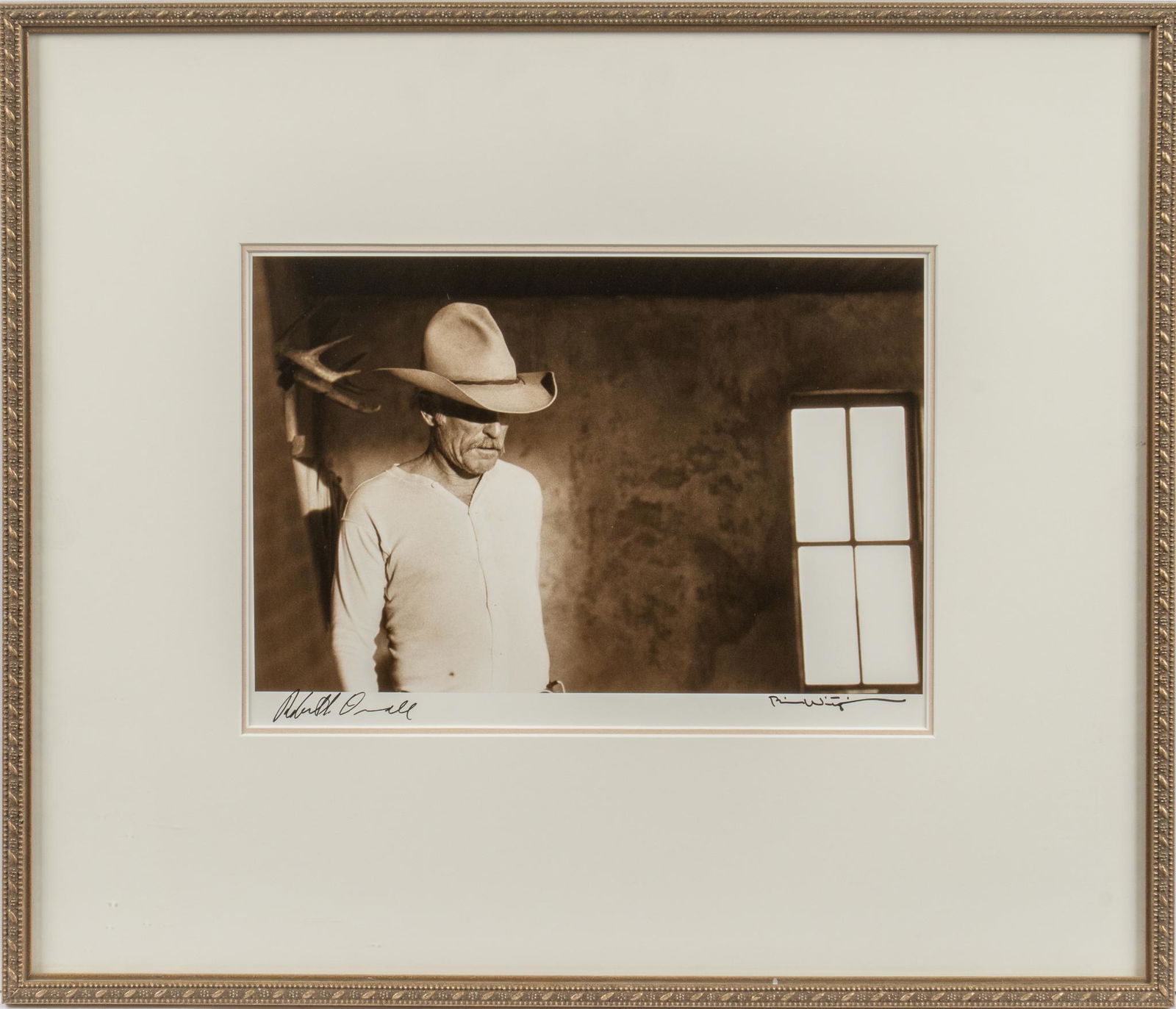 Bill Wittliff "Augustus" Photograph, Signed by Robert Duvall: Bill Wittliff (b. 1940, USA) "Augustus" photograph of Robert Duvall as Augustus 'Gus' McCrae from the Lonesome Dove television mini-series, sepia toned, framed and matted, hand-signed