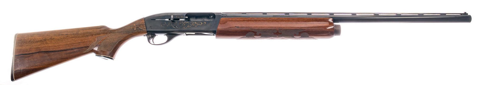 Remington 1100 Bicentennial 12-Gauge Shotgun: Serial: M352499V Manufacturer: Remington Arms Co. Inc. Model: 1100 Bicentennial Caliber: 12 Ga. Barrel length: 25.5 in. OAL: 46 in. Condition: Very Good; wood stock has light handling marks; barrel &a