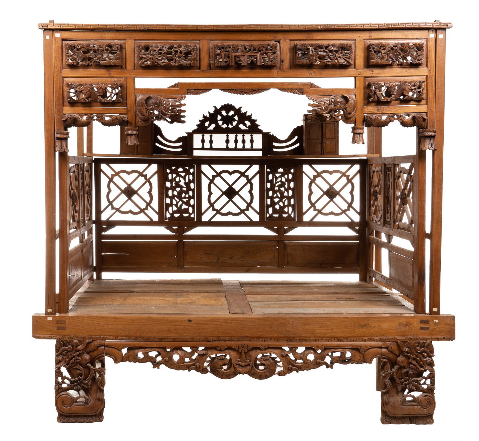 Impressive Polynesian Canopy Bed: Impressive Polynesian canopy bed of Balinese origin, featuring extensive carving throughout, paneled sides and back, below canopy ceiling with inlaid architectural panels depicting nature motifs, from
