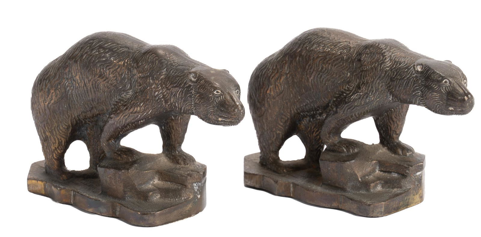 Pair of Vintage Bear Bookends: Pair of vintage iron bookends, each in the figure of a bear standing on an uneven stone ground, with green felt bottoms; includes Certificate of Authenticity: Estate of author Larry McMurtry, from his