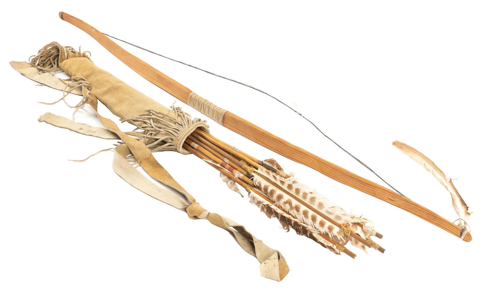 Vintage Native American Bow and Arrow: Vintage Native American bow and arrows, with leather hide quiver, with fringed top and bottom, holding twelve arrows, carved bow with string; includes Certificate of Authenticity: Estate of author Lar