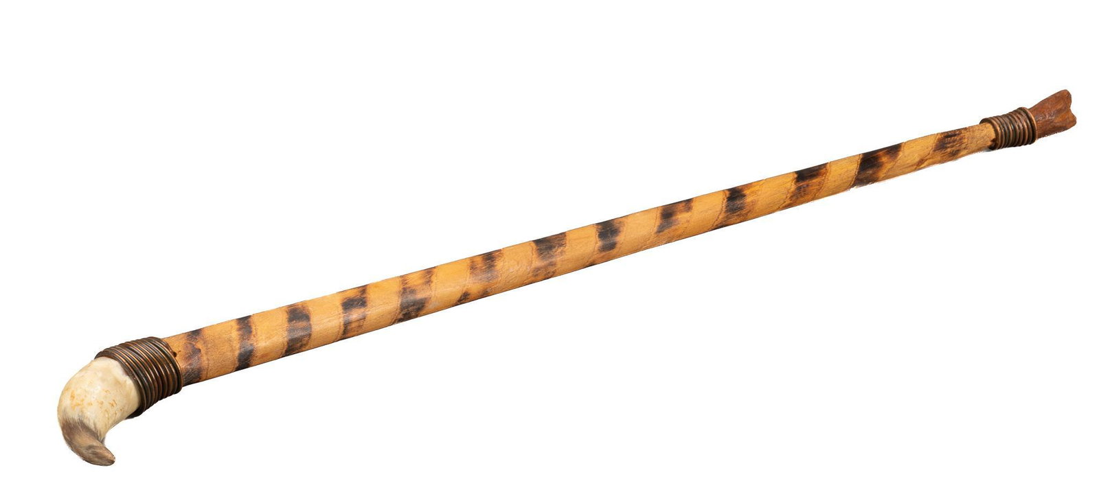 Horn Handled Walking Stick: Carved walking stick featuring horn handle, wrapped with copper wire, over patterned staff, ending in deer hoof foot; includes Certificate of Authenticity: Estate of author Larry McMurtry, from his Ar