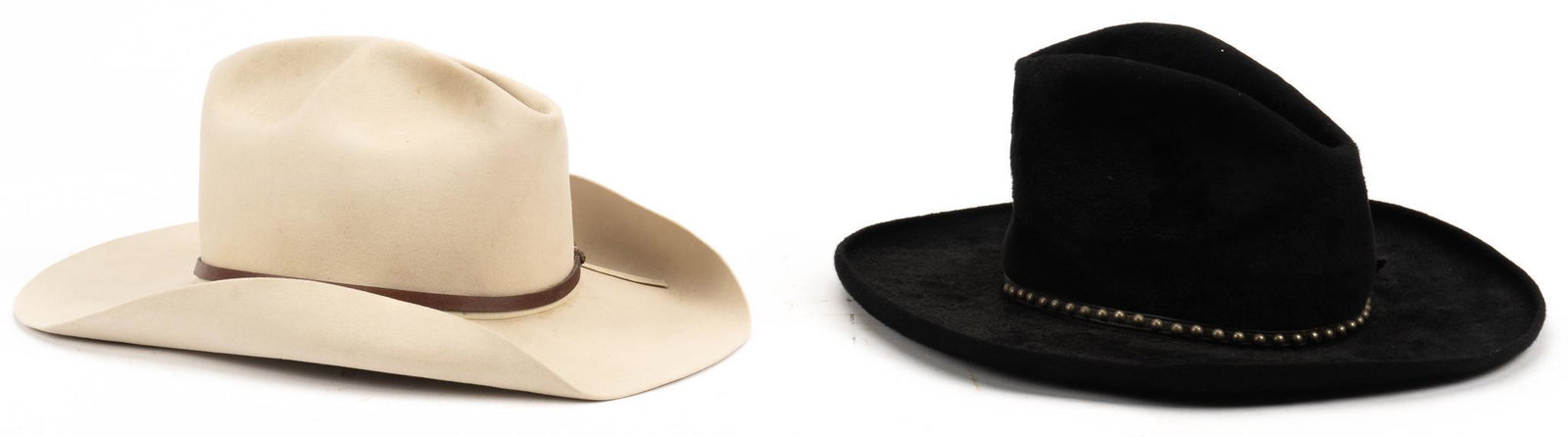 (2) Cowboy Hats: Two cowboy hats, including one Resistol 20X cowboy hat, marked one early black beaver collector cowboy hat, size 7 1/8, marked John B. Stetson height 5.5 in. x width 14 in. x depth 16 in. Provenance: 