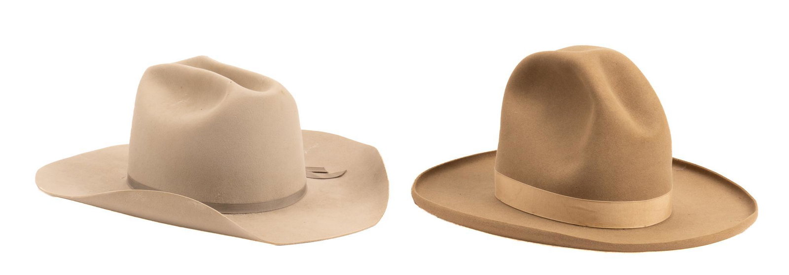 (2) John B. Stetson Cowboy Hats: Two John B. Stetson cowboy hats, including one early 1900s Montana Peak Cowboy hat one, one felt cowboy hat, size 7 1/2 height 7 in. x width 12 in. x depth 15.5 in. / Montana Peak Hat Provenance: An A