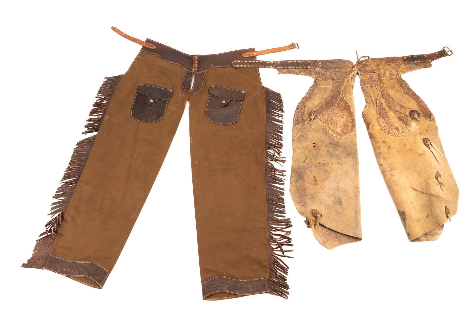 (2) Pairs of Chaps: Two pairs of chaps. including one pair of South Texas cowboy bat wing chaps, with leather conchos, scalloped pockets, one pair of fringed brown leather shotgun chaps, with pockets length 34 in. / long