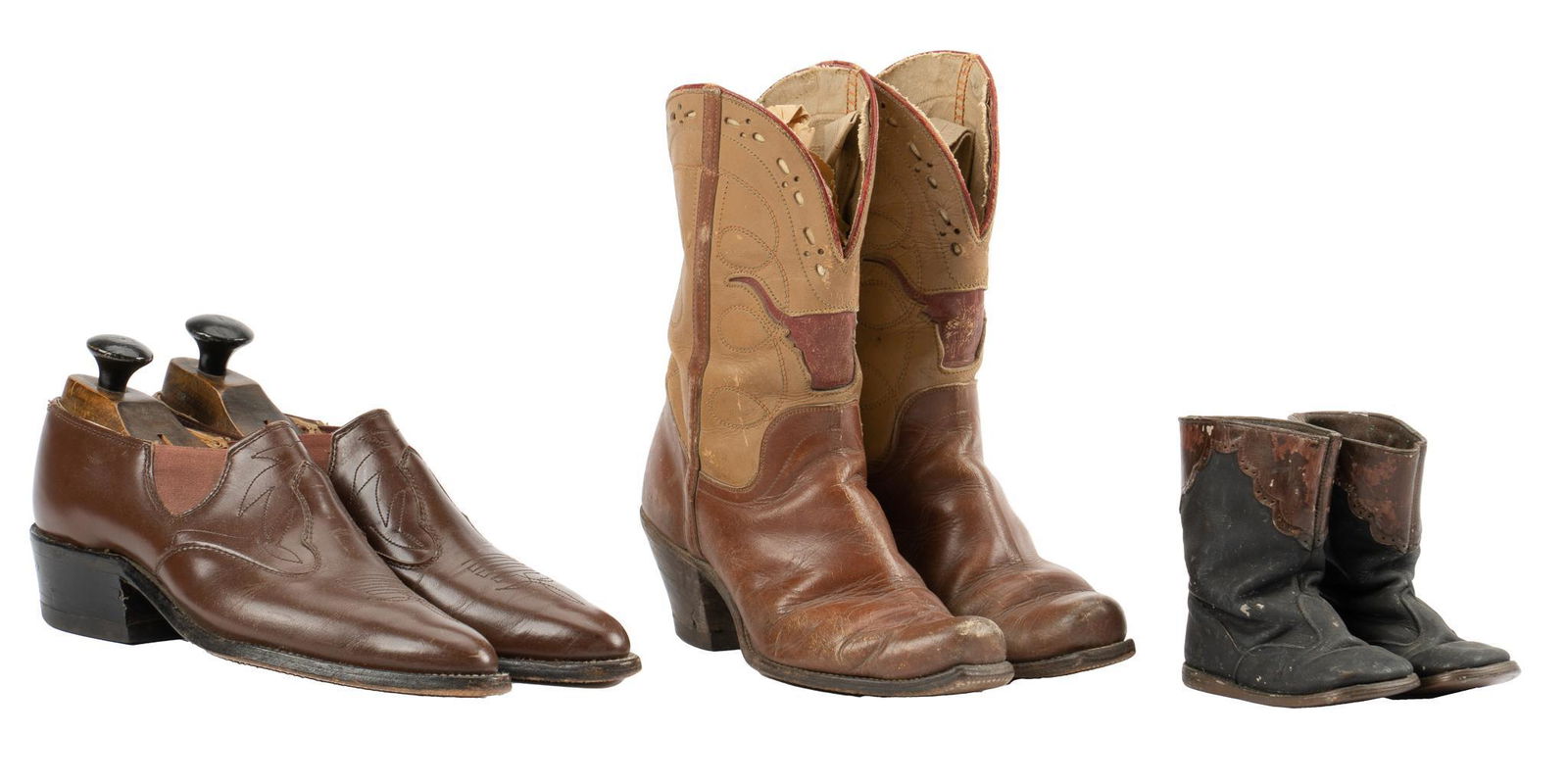 (3) Pairs of Vintage Boots: Three pairs of vintage boots, including one vintage tan and brown leather pair of cowboy boots with red leather accents, inlaid longhorn / steer, marked "Cats Paw" on heels, one pair of early