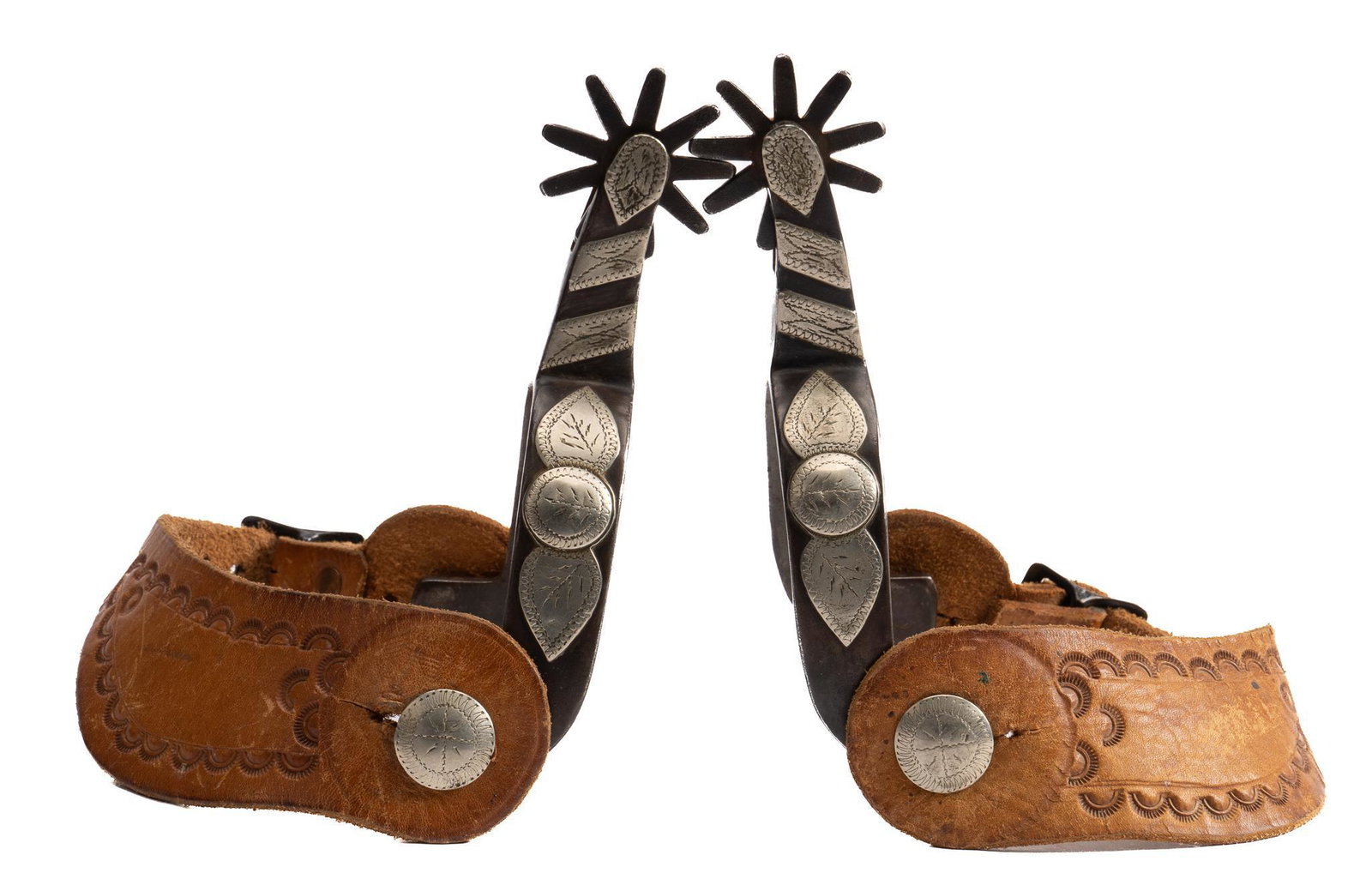 Crockett Marked Silver Mounted Spurs: Crockett marked silver mounted spurs, with steel heel bands, mounted peanut pattern silver inlay, with engraved accents, nine point rowels, stamped leather heel straps, both marked Crockett on interio