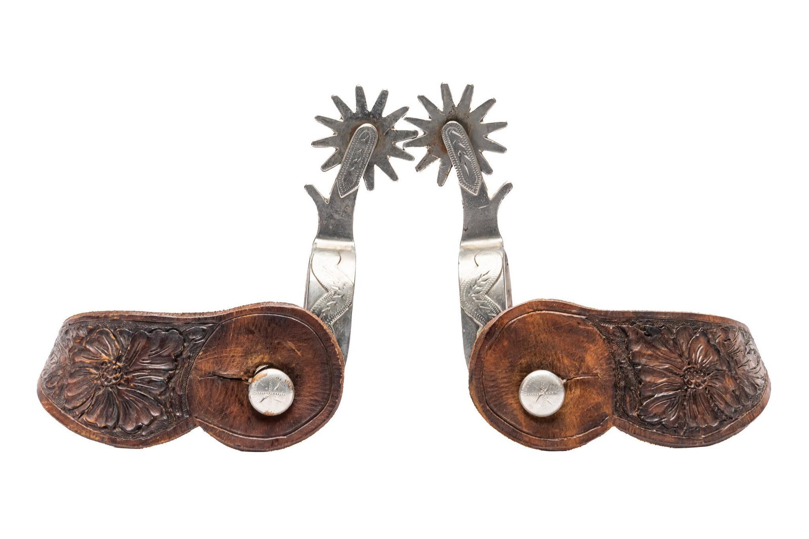 Crockett Silver Mounted Spurs: Crockett spurs, with steel heel bands, silver mounted mustache pattern with engraved accents, twelve point rowels, stamped and carved floral leather heel strap, edge-marked "Crockett" heel ban