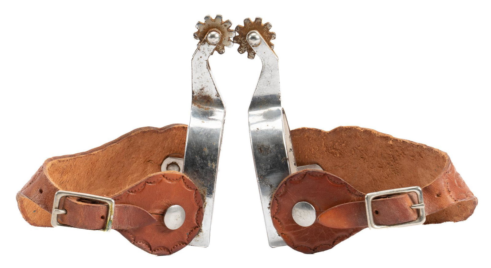 Pair of Crockett Renalde Spurs: Pair of Crockett Renalde marked spurs, aluminum heel bands, 10 point rowels, brown leather heel straps with tooled border and marked "Shanks Bros", marked on swing arm heel band width 3.5 in. 