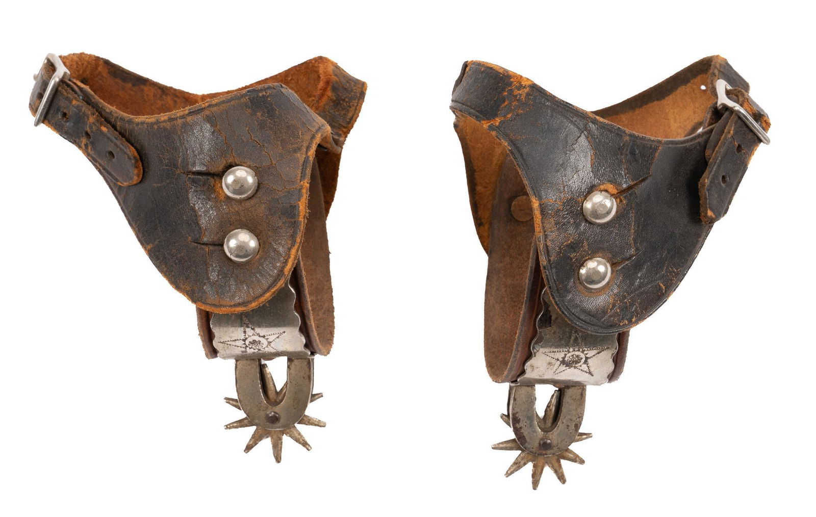 Rare August Buermann Trail Drive Era Cowboy Spurs: Rare August Buermann Trail Drive Era cowboy spurs, with steel heel bands, engraved star motif, ten point rowels, featuring original period leather lining and straps heel band width 3 in. x spur lengt