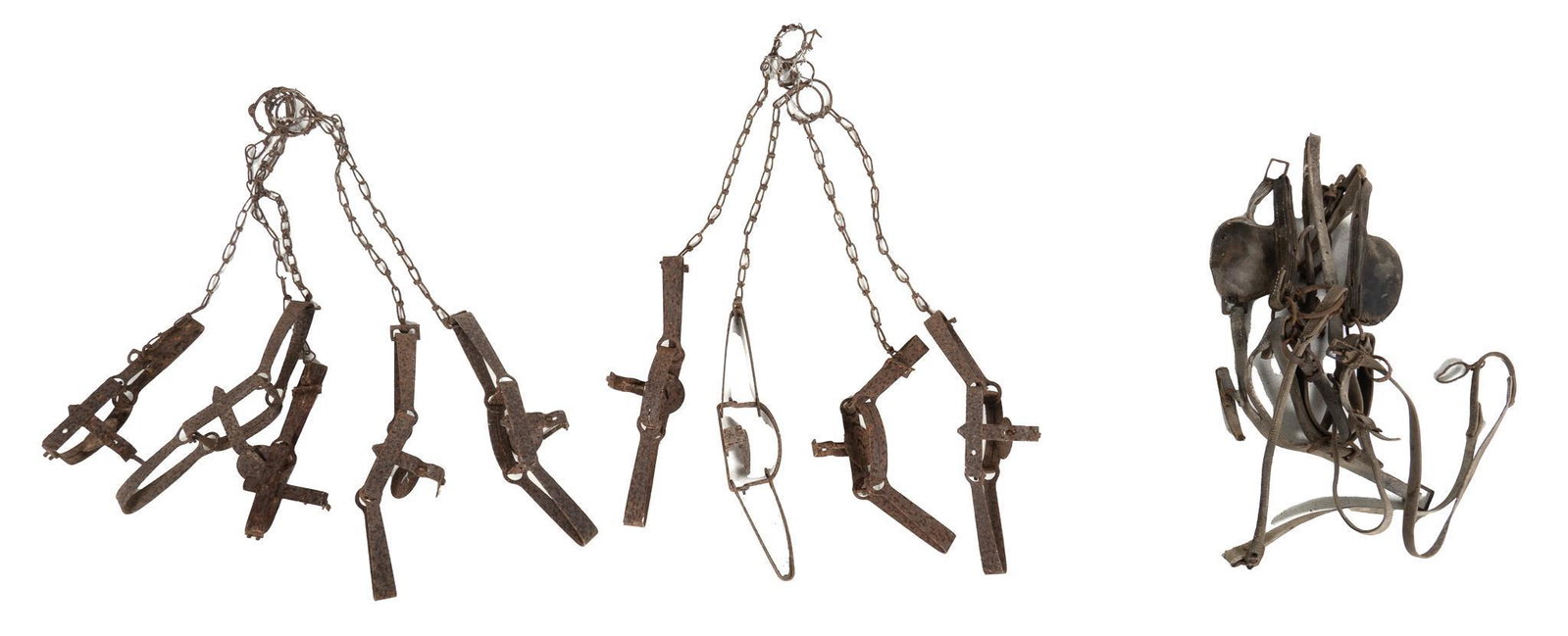 Collection of Vintage Animal Traps: Collection of vintage animal traps and tools, including fourteen small traps, one horse bit with blinders, one single spur height 31 in. x width 6 in. x depth 3 in. Provenance: A Kerrville, Texas coll