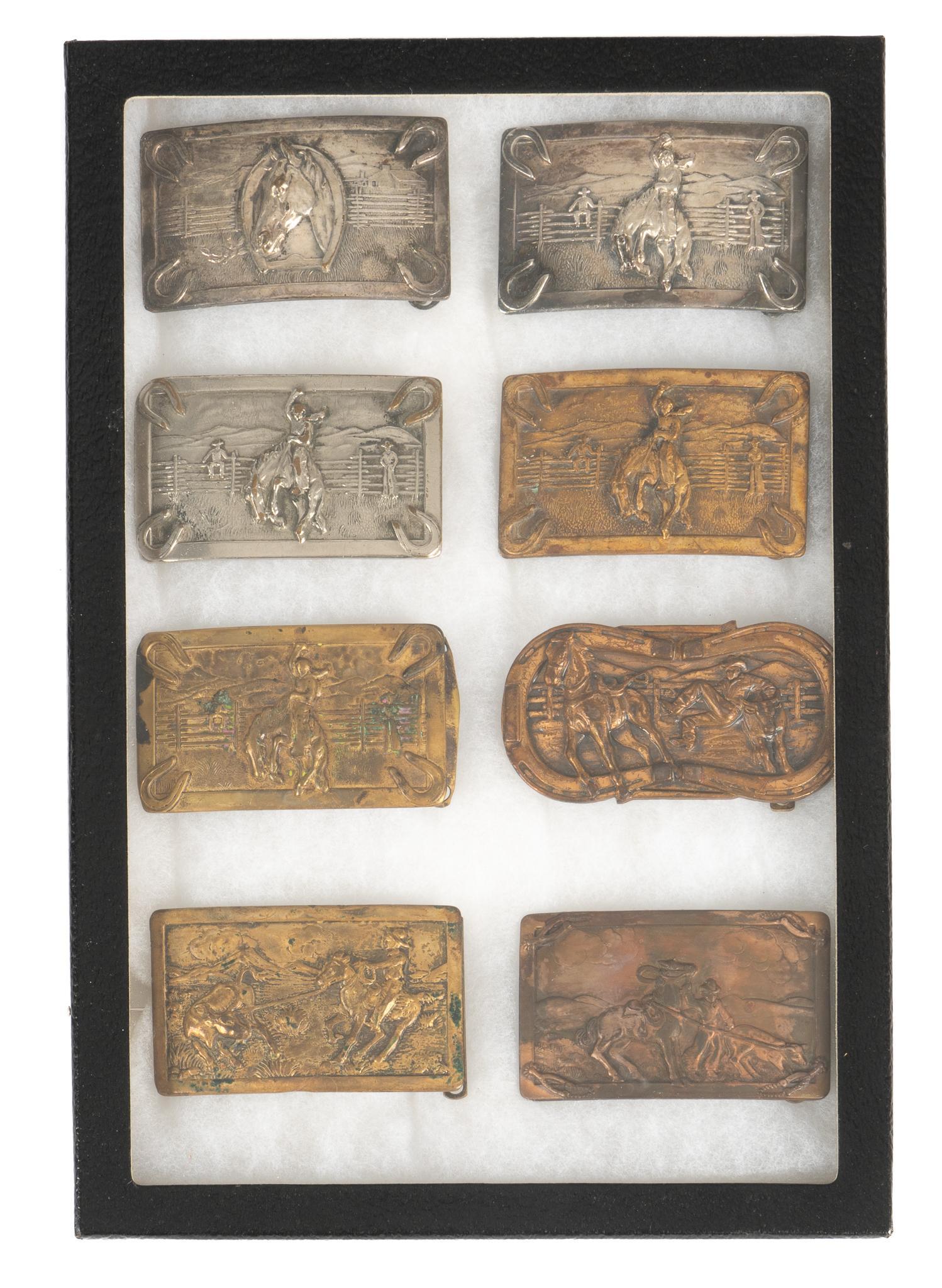 Collection of (8) Vintage Western Belt Buckles: Collection of eight vintage brass belt buckles, including three marked Justin Belt Co. (Fort Worth, Texas), one marked Leavens Manufacturing Co. (Chicago, Illinois) height 2 in. x width 3.5 in. x dept