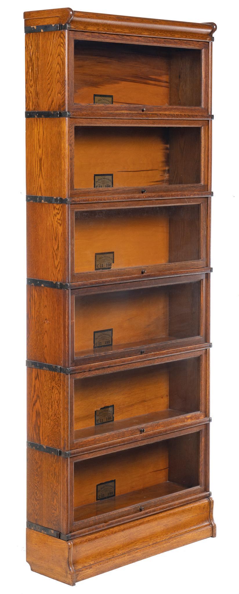 Vintage Globe-Wernicke Co. Stacking Bookcase: Vintage Globe-Wernicke stacking bookcase, with six stacking shelving units, size C-11, grade 198, each with sliding glass-front drawers, marked to back with label height 89 in. x width 34 in. x depth 