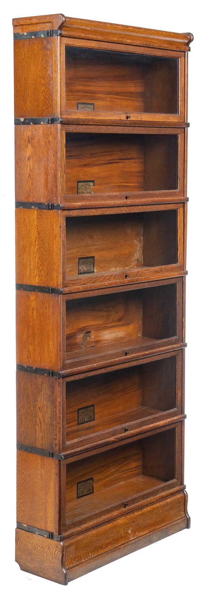 Globe-Wernicke Stacking Bookcase: Globe-Wernicke stacking bookcase, with six units, size C-11, grade 198, sliding glass doors, with labeled backs height 89 in. x width 34 in. x depth 10 in. Provenance: A Bandera, Texas antique dealer 