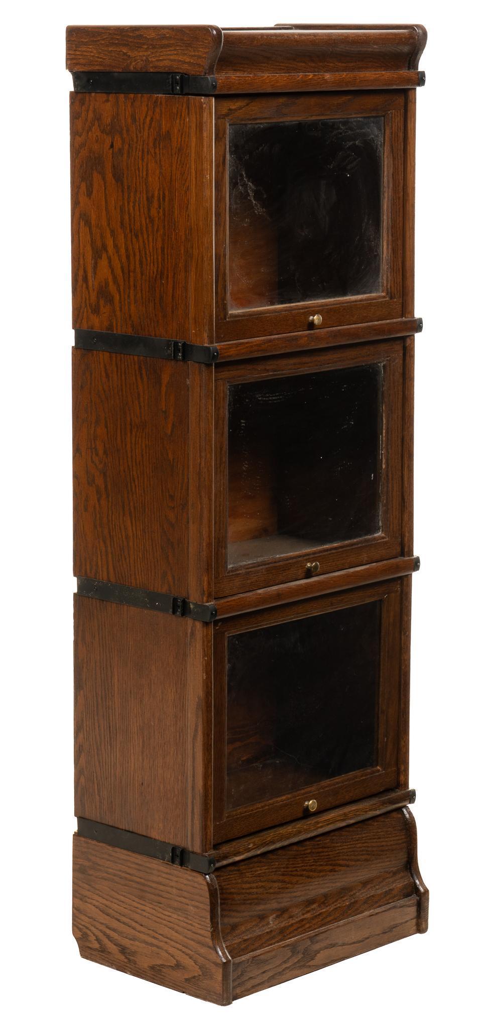 Stacking Bookcase: Stacking bookcase, with three units, sliding glass front doors, with hinged top opening to hidden storage height 49.5 in. x width 17 in. x depth 10.5 in. Provenance: A San Antonio, Texas collection We