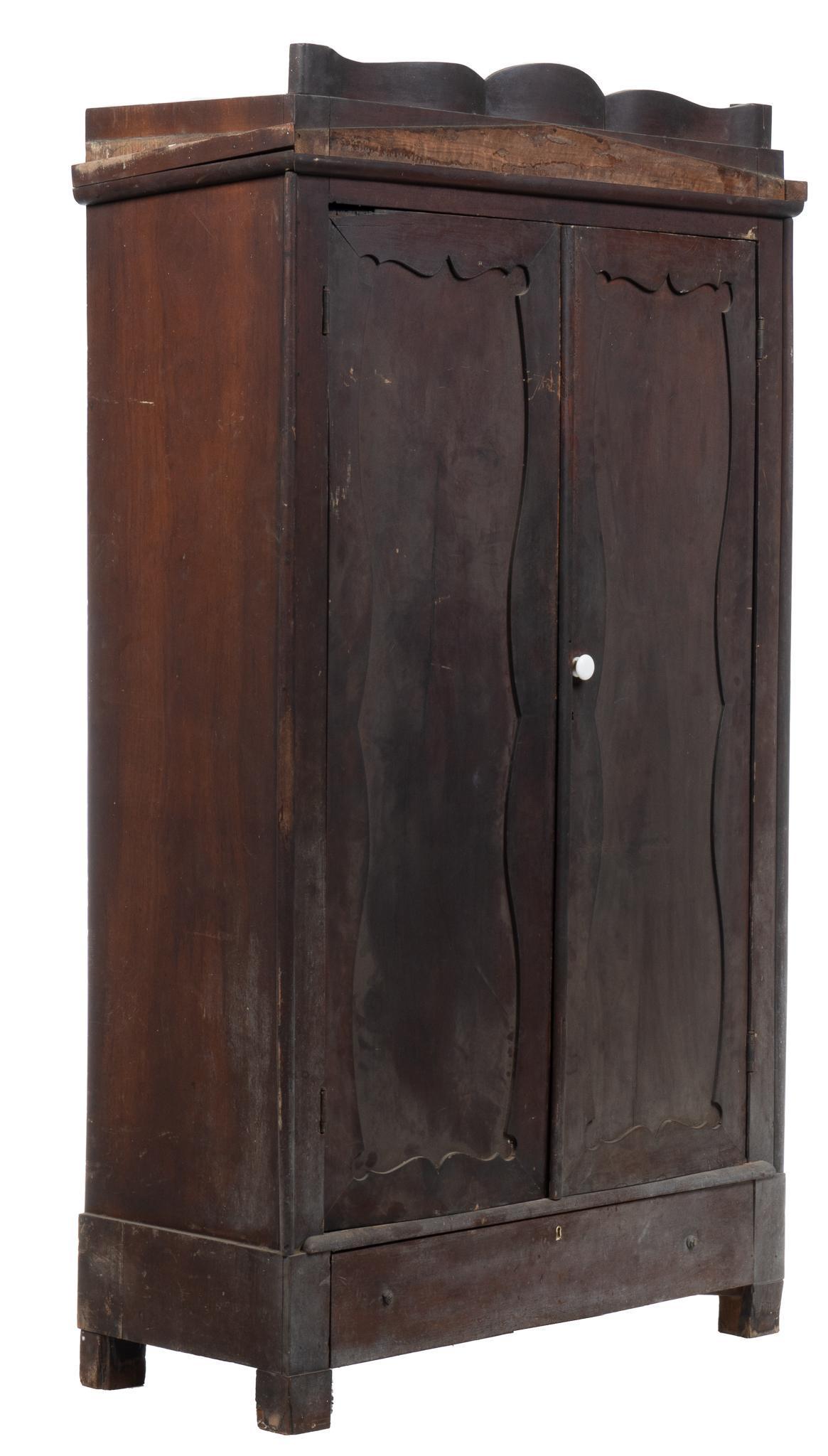 Early Texas (San Antonio) Wardrobe: Early Texas (San Antonio, Texas) painted double wardrobe, primitive construction on blocked legs, with shaped crown and two paneled doors that open to an open interior, drawer in base height 80 in. x 