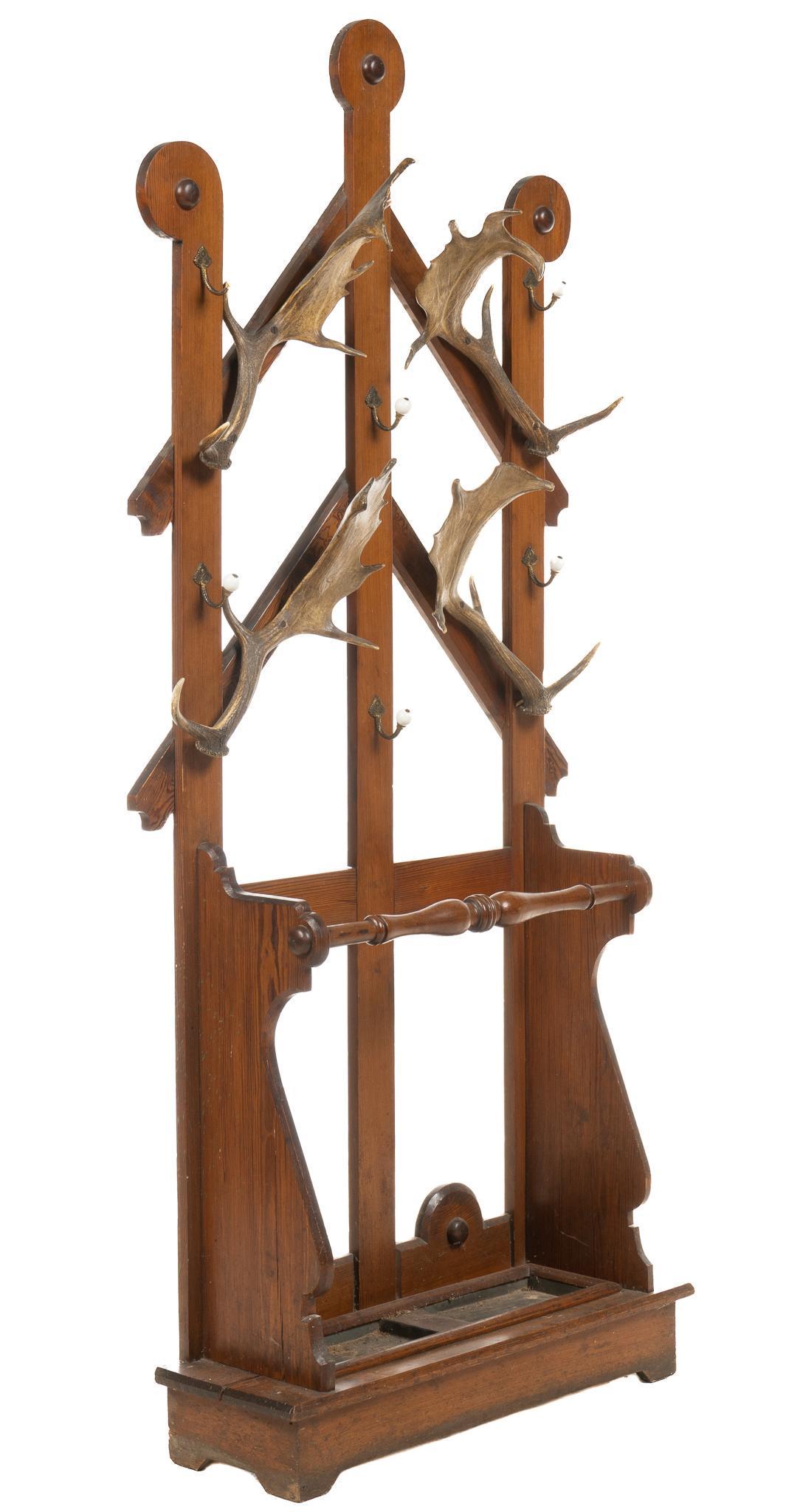 Rustic Buckhorn Hall Tree: Rustic hall tree, with lattice back, supporting four mounted buckhorns, each with 5 to 6 points, one marked in pencil, six brass hooks, ending in porcelain baubles, over umbrella rack, featuring turne