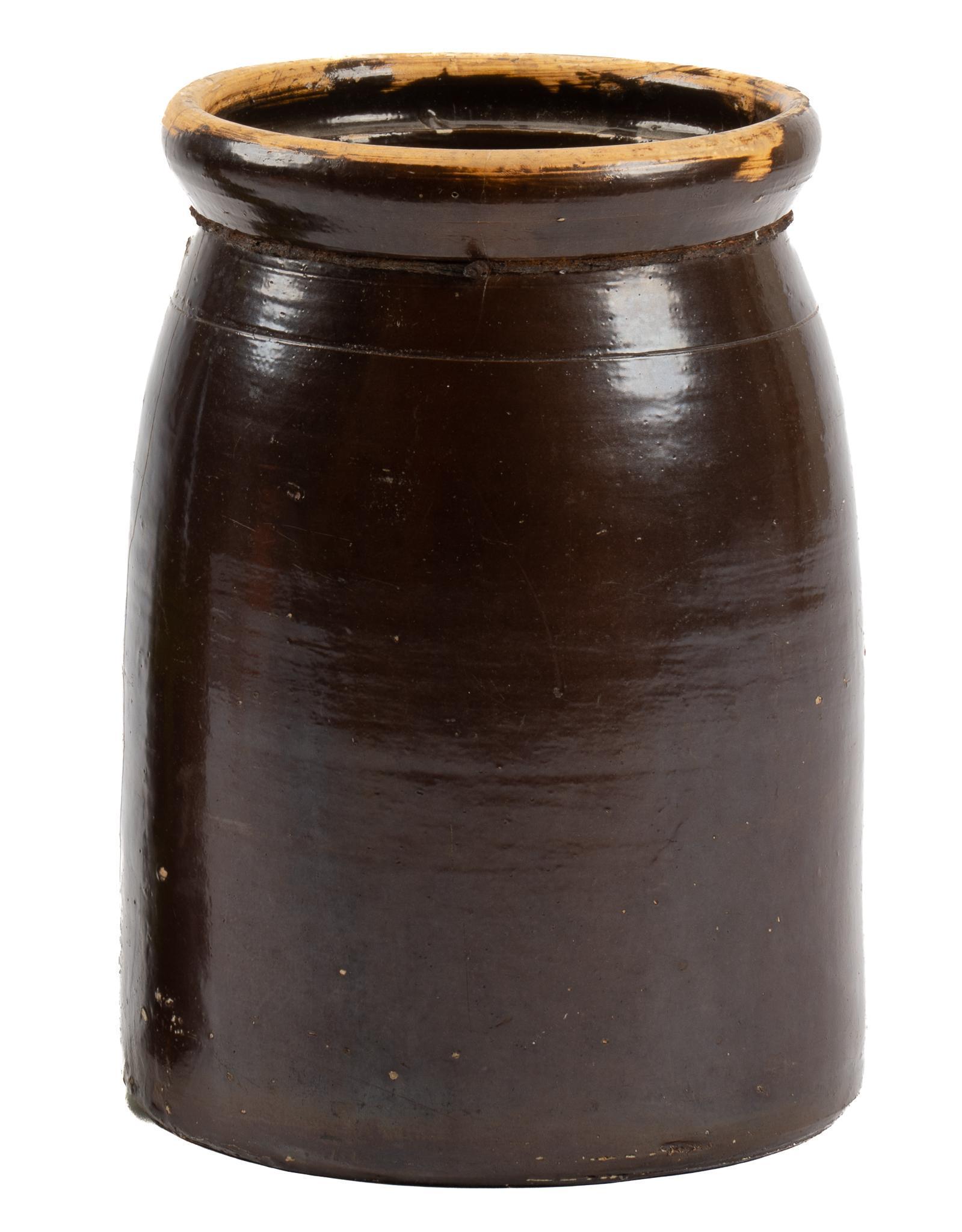 Meyer (TX) Slip Glaze Butter Churn: Meyer Pottery (1887-1962, Texas) slip glazed butter churn, with flared rim, interior ridge, glazed interior, previous period repair height 11 in. x diameter 8 in. Provenance: A San Antonio, Texas coll
