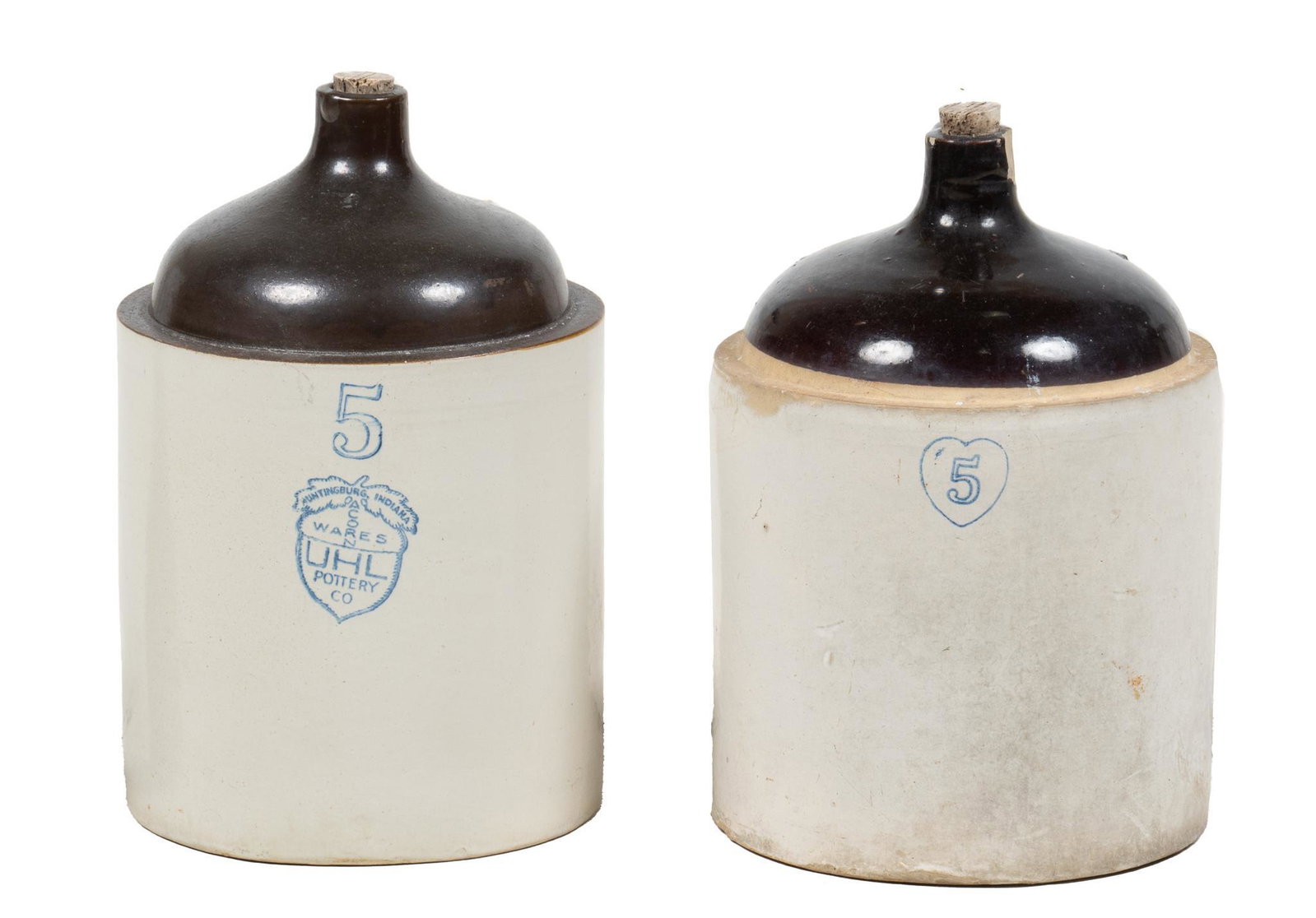 (2) Vintage 5 Gallon Stoneware Whiskey Jugs: Two five gallon stoneware whiskey jugs, dark brown glaze tops, both corked, one from Burley & Winter Pottery (Ohio) marked with a cobalt blue '5' inside a heart, one from Uhl Pottery (Indi