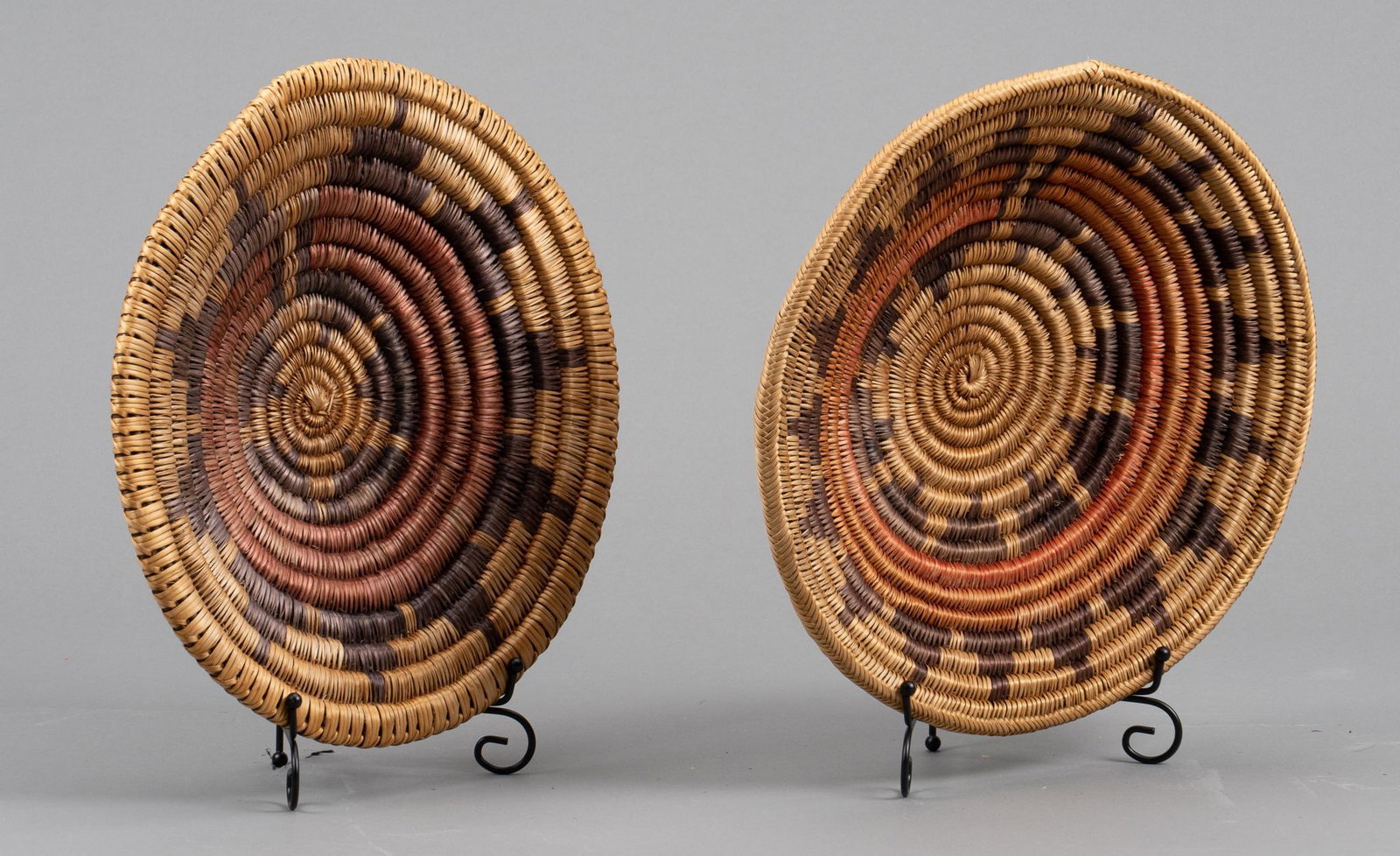 (2) Navajo Wedding Baskets: Two Navajo wedding baskets, also known as ceremonial baskets, hand-coiled height 2.5 in. x width 13.5 in. x depth 13.5 in. / largest Provenance: A Pleasanton, Texas estate We happily provide seamless 