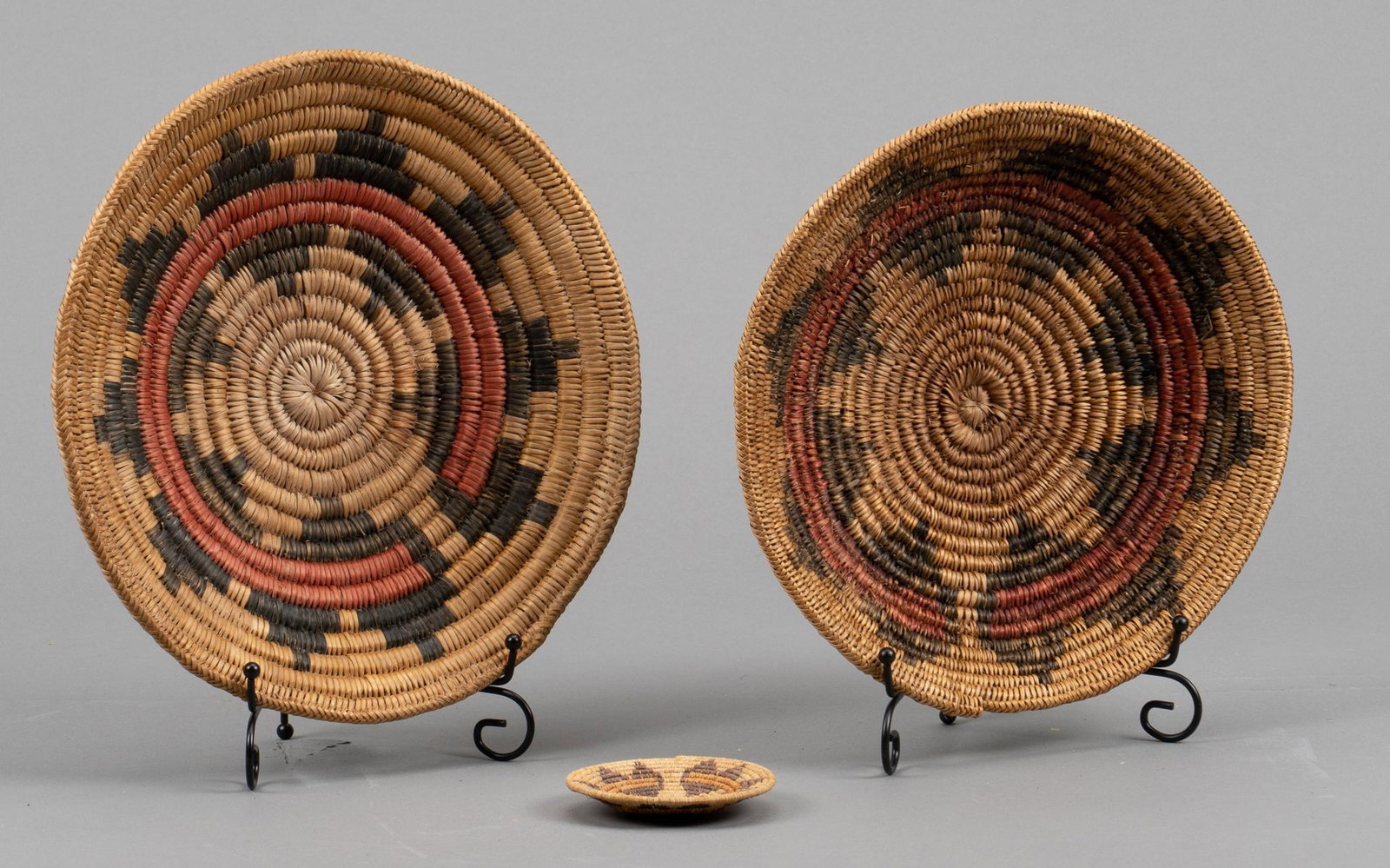 (3) Navajo Wedding Baskets: Three Navajo wedding baskets, also known as ceremonial baskets, hand-coiled height 2.5 in. x width 12 in. x depth 12 in. / largest Provenance: A Pleasanton, Texas estate We happily provide seamless sh