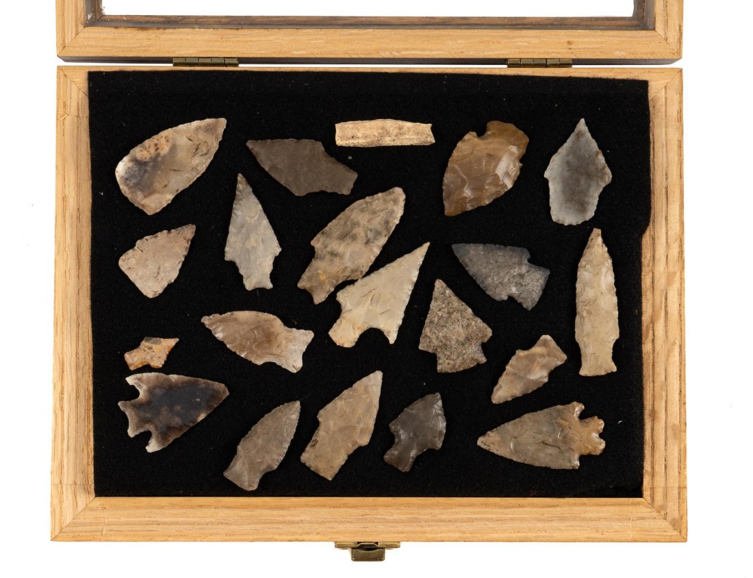 Collection of (20) Archaeological Samples of Tools: Collection of twenty archaeologic samples of tools, including nineteen projectile points, mostly arrowheads, one piece of bison bone, mounted in display box with hinged top height 9 in. x width 12 in.