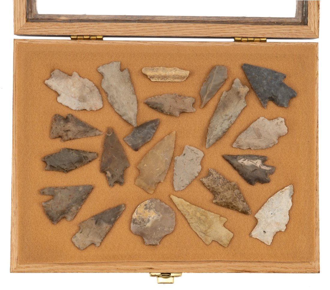 Collection of (21) Native American Tools: Collection of twenty-one tools, including twenty arrowheads / projectile points, one small bone fragment, mounted in display box with hinged top height 9 in. x width 12 in. x depth 2 in. / case Proven