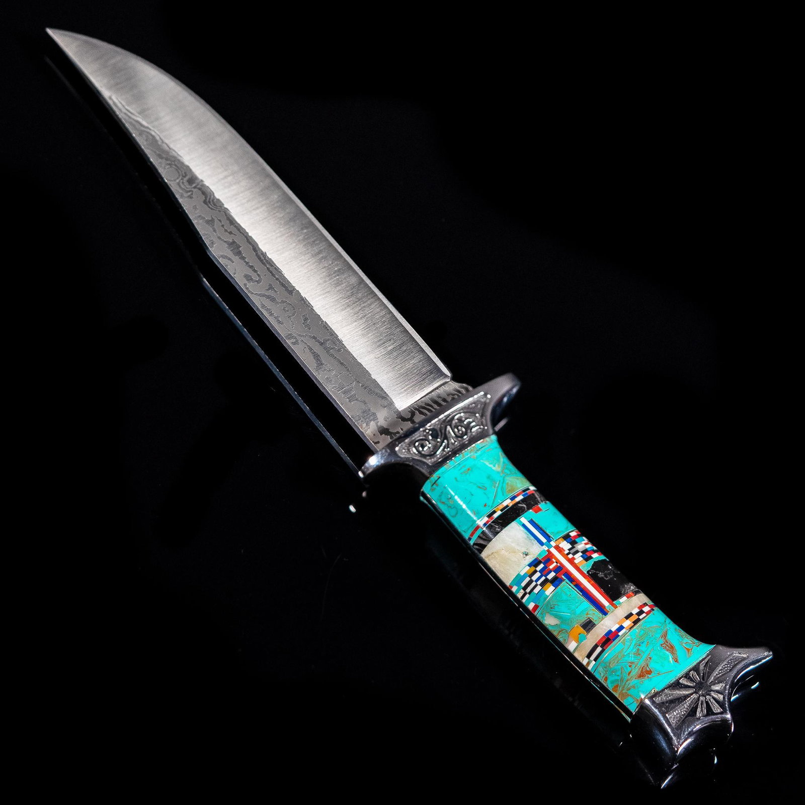 Hand-Made Zuni Turquoise Inlay Damascus Steel Knife with Sheath: Hand-made Zuni Damascus steel blade knife with turquoise inlaid handle, floral, scrolled, and sunburst details on handle, with sheath Total length approx. 12", blade length approx. 7 1/8" Prov