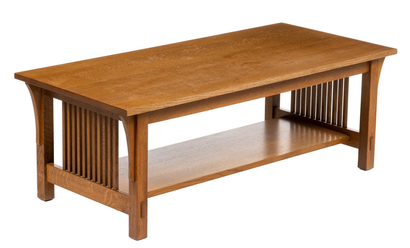 Stickley (USA) Coffee Table: Stickley Audi & Co. (USA) Mission coffee table, with rectangular top, supported on corbel arches, flanking spindle sides, above shelf, with pinned-through tenons, on block legs, marked under shelf