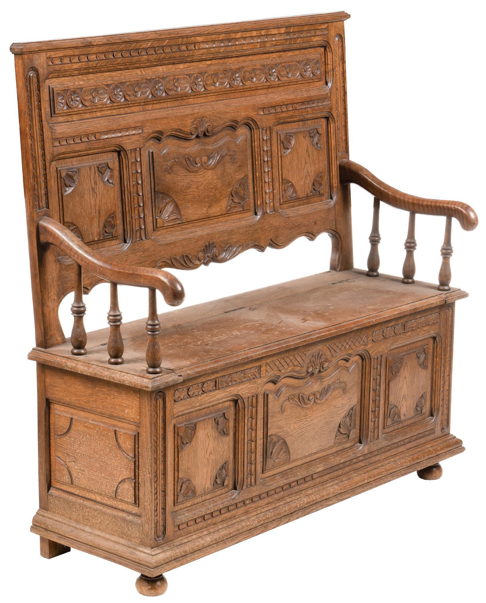 Vintage Gothic Revival Carved Hall Bench: Vintage Gothic Revival style carved hall bench, paneled and carved backrest and sides, floral and shell motifs, backrest with serpentine bottom edge, downward sloping armrests with turned railing, hin