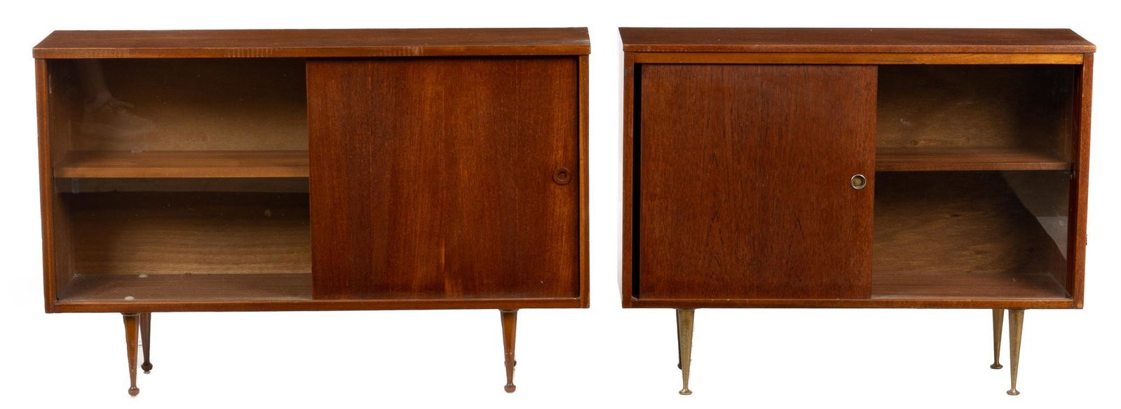 Pair of Mid-Century Sideboards: Pair of Mid-Century sideboards, with sliding doors and shelved interiors, raised on pin legs, marked "Roseberry Unit Furniture" height 27.5 in. x width 42 in. x depth 11 in. We happily provide
