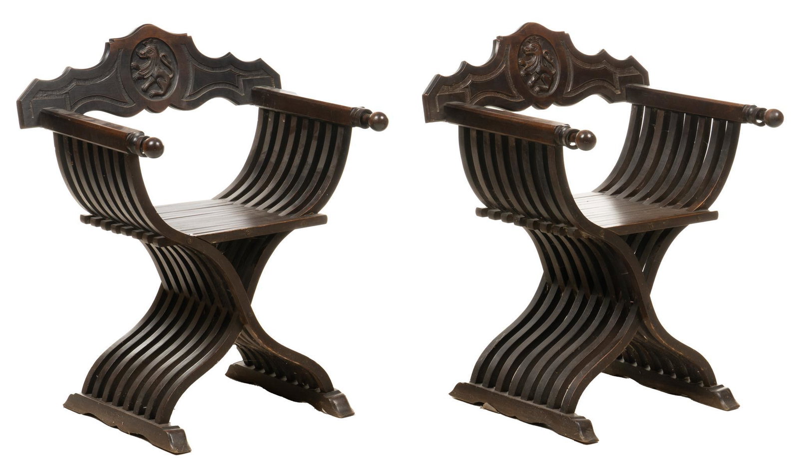 Pair of Vintage Savonarola Chairs: Pair of vintage wooden savonarola chairs, scalloped and serpentine backrest with center shield featuring griffin in profile height 32.5 x width 26.5 x depth 18.5 / each Provenance: The Estate of Dr. R