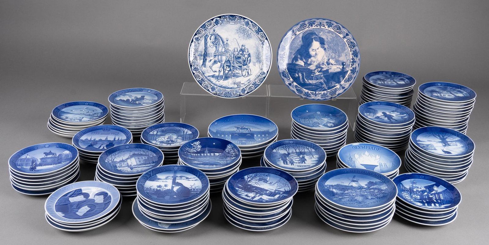 Collection of Blue Delftware: Collection of delftware, marked examples by Royal Copenhagen, Bing & Grondahl, Chemkefa, including charger plates, dinner, salad plates, featuring numerous designs Provenance: A Terrell Hills, Tex