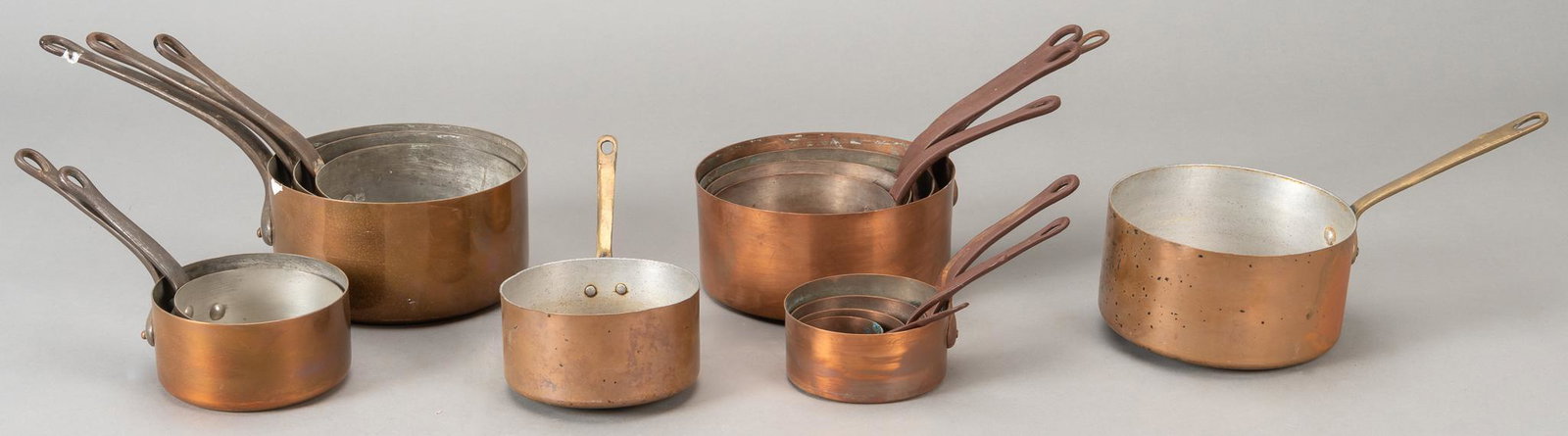 Set of (15) Nesting Copper Pots: Set of fifteen nesting lined and unlined copper pots, of graduating size, marked made in France height 7 in. x width 15 in. x depth 8 in. / largest Provenance: A Terrell Hills, Texas collection We hap