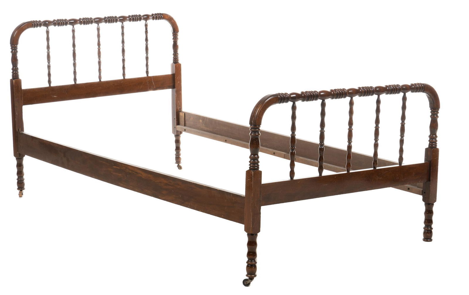 Vintage Spool Bed: Vintage spool bed, with wooden frame, featuring spooled headboard and footboard, with turned balustrade rails, supported on casters height 37 in. x width 80 in. x depth 41 in. Condition: Missing cas