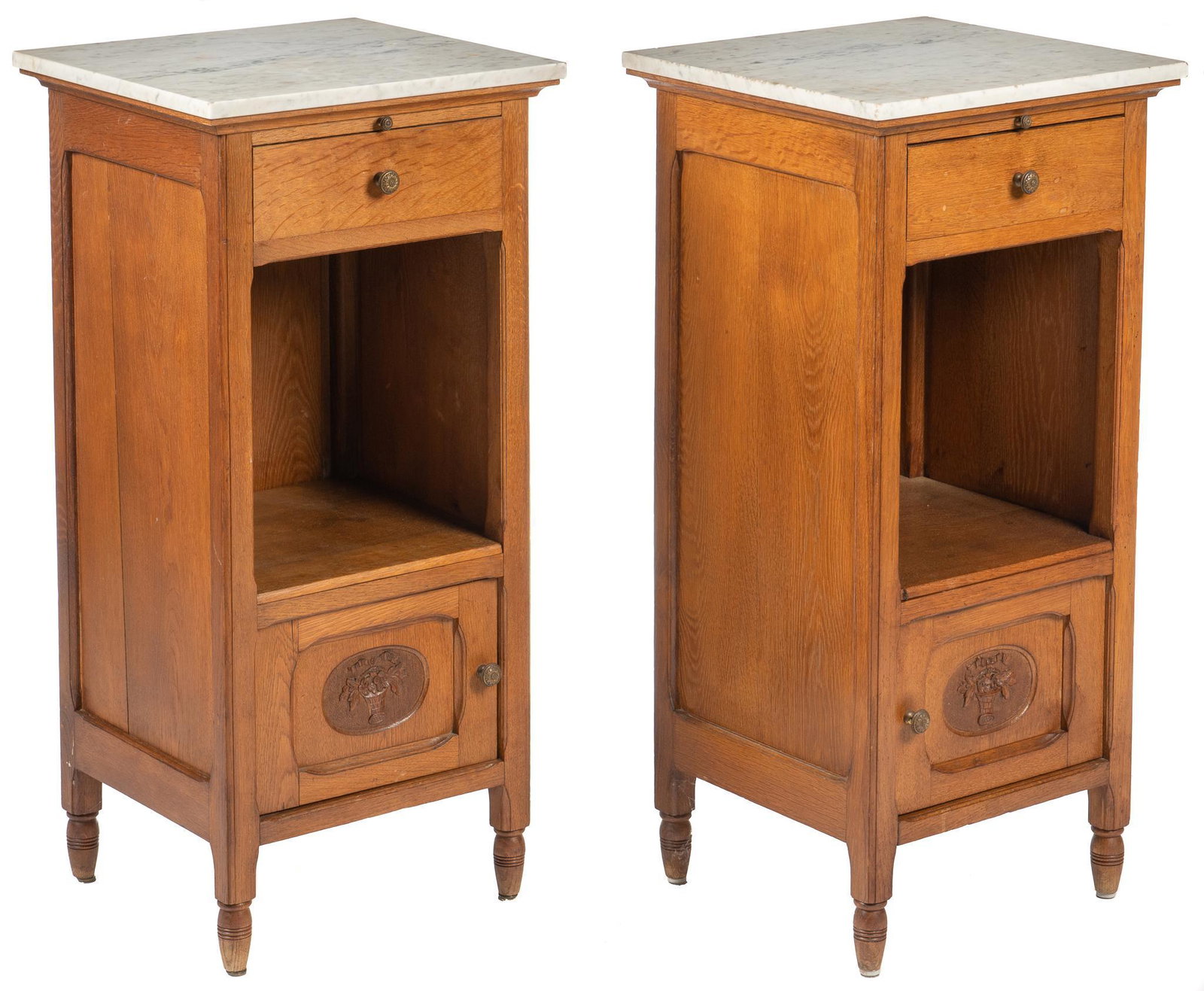 Pair of Art Nouveau Nightstands: Pair of Art Nouveau nightstands, with rectangular marble tops, above sliding tablet, single drawer, open storage niche, carved cabinet door, opening to removable enameled lining, marked, circa 1900 he