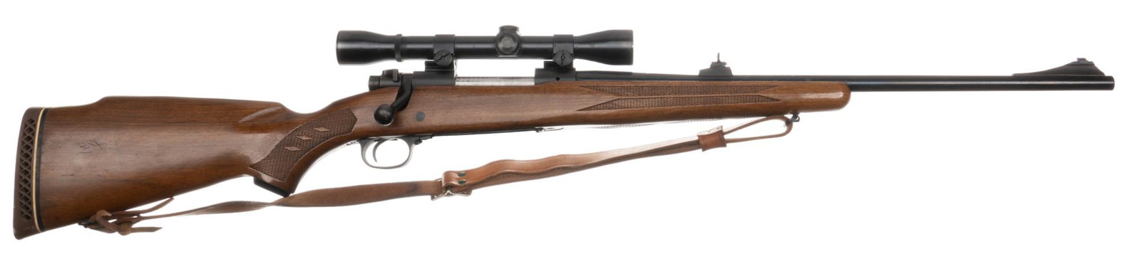 Winchester Model 70 243 Win Bolt Action Rifle: Serial: 755506 Manufacturer: Winchester Model: 70 Caliber: 243 Winchester Barrel: 43 in. Condition: Very Good; Walnut stock has light handling marks; receiver and barrel have good bluing, with the bar