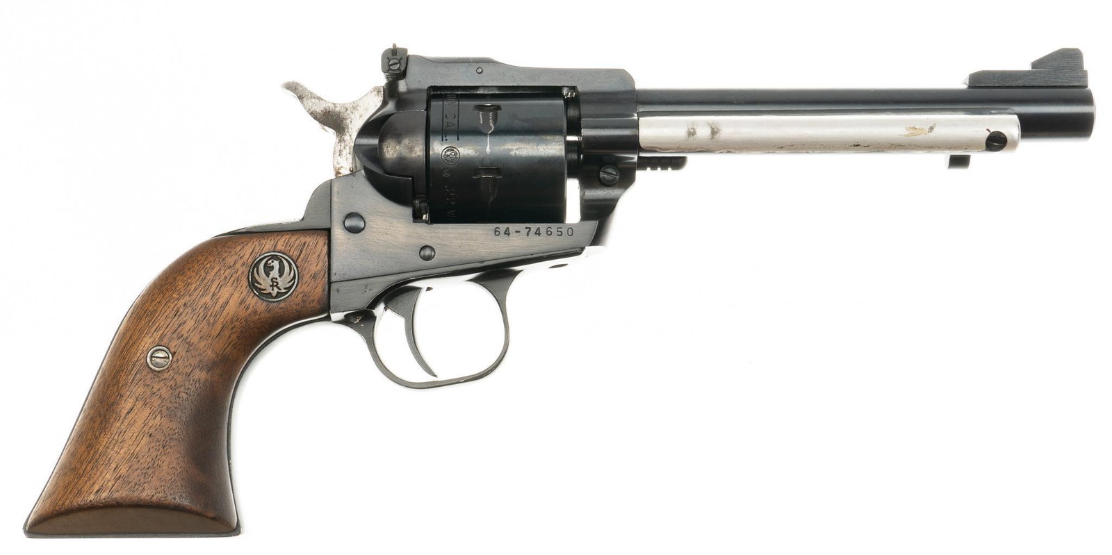 Ruger New Model Single-Six .22 WMR Revolver: Serial: 64-74650 Manufacturer: Sturm, Ruger & Co. Model: New Single-Six Caliber: 22 Winchester Magnum Barrel length: 5.5 in. OAL: 11 in. Condition: Good; wood grips have light handling marks; barr