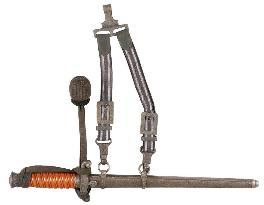 German WWII Army Wehrmacht Dagger W/ Accessories: Manufacturer: W.K.C., Solingen Model: M35 Blade Length: 10 in. Overall Length: 15.5 in. Condition: Very Good; blade has marks from insertion into the scabbard with some polishing marks (appears to be