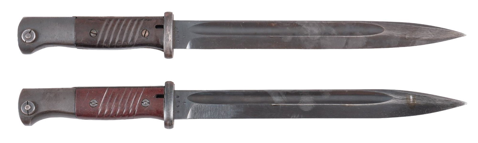 Pair of German WWII Mauser K98 Bayonets: Includes: (1) K98 Bayonet, marked "fze 43" w/ scabbard; (2) K98 Bayonet, marked "cul 43" w/ scabbard & frog Blade length: 10 in. Overall length: 16 in. Condition: (1) Very Good: Bl