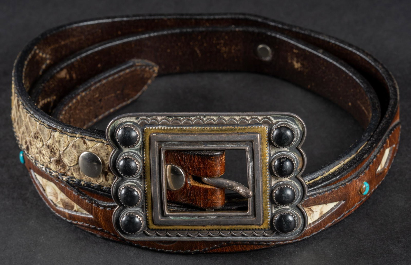 Southwick Leathers Southwestern Belt: Southwick Leathers belt, leather with python skin and turquoise, sterling silver conchos, belt buckle marked total length 47.5" Provenance: A Fredericksburg, Texas collection We happily provide se