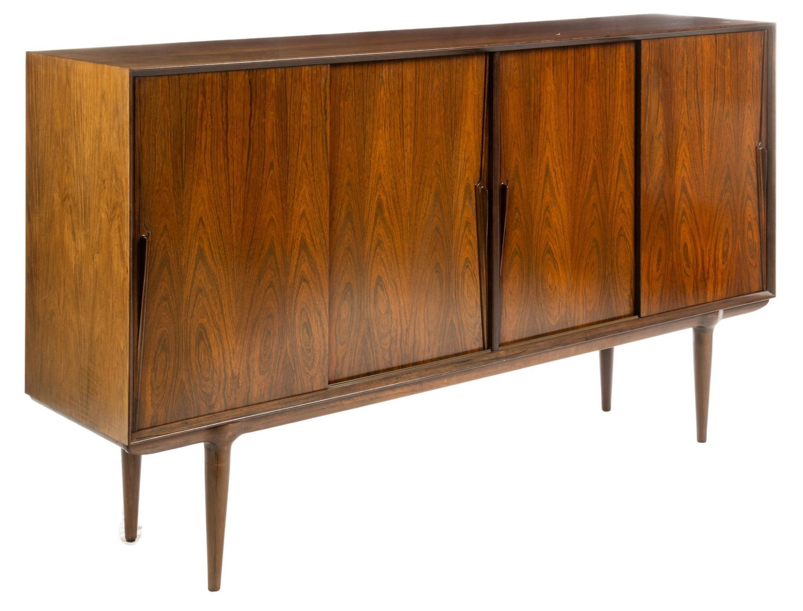 Attrib. Omann Jun Mobelfabrik (DNK) Mid-Century Credenza: Danish Mid-Century credenza / sideboard, attributed to Omann Jun Mobelfabrik (Denmark), model 19, featuring four sliding doors, with that open to shelved storage space, supported by pin legs height 3
