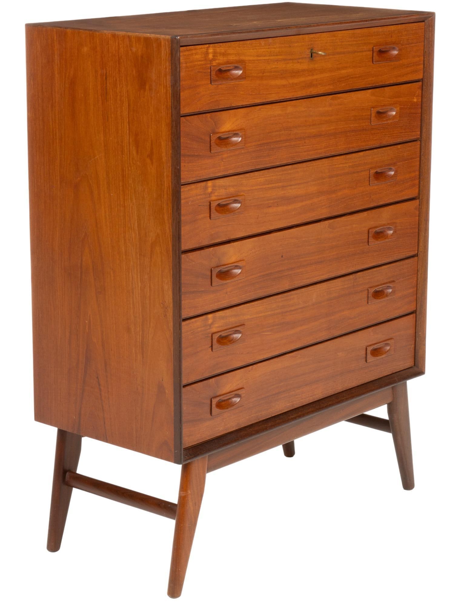 Danish Mid-Century Chest of Drawers: Danish Mid-Century chest of drawers, top locking drawer with key, six drawers, supported by tapered legs height 43 in. x width 32.5 in. x depth 16.5 in. Condition: notable damage on rear right side, l