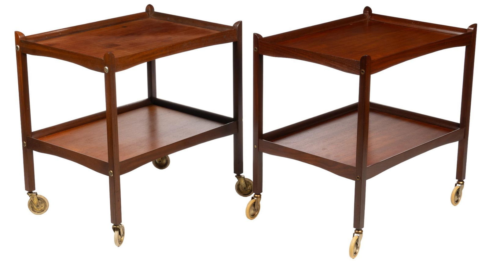 Pair of Danish Mid-Century Two-Tiered Bar Carts: Pair of wood bar carts with two tiers, supported on four legs ending in casters height 27 in. x width 25.5 in. x depth 19 in. We happily provide seamless shipping serv