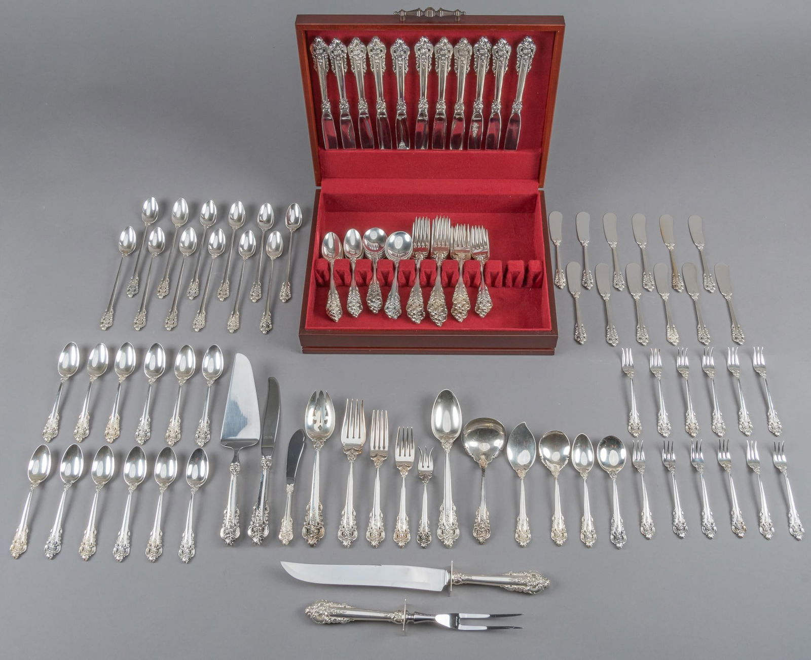 "Grand Baroque" by Wallace 119 Piece Flatware Set: "Grand Baroque" by Wallace Silversmiths flatware set, no monogram or removal, marked "Wallace Sterling", 119 pieces total Includes: 12 iced tea spoons 2 piece carving set 24 tea spoon