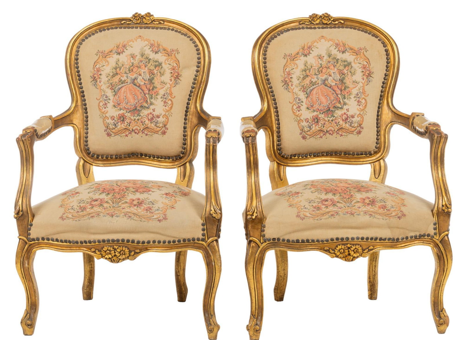 Pair of Louis XV Style Armchairs: Pair of Louis XV style armchairs, with balloon backs, gold toned frames with carved floral motifs, supporting needlepoint upholstery, stud trim, on cabriole legs height 37 in. x width 25 in. x depth 2